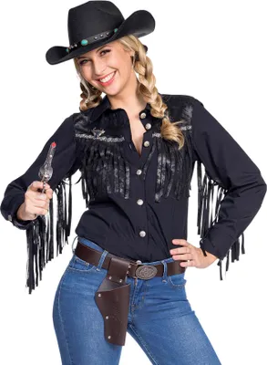A woman dressed as a cowgirl, holding a toy gun.