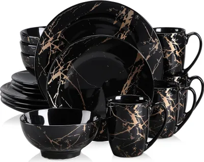 A set of black and gold marble-patterned dinnerware is displayed.
