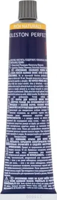 A close-up, front-facing studio shot of a tube of hair dye.
