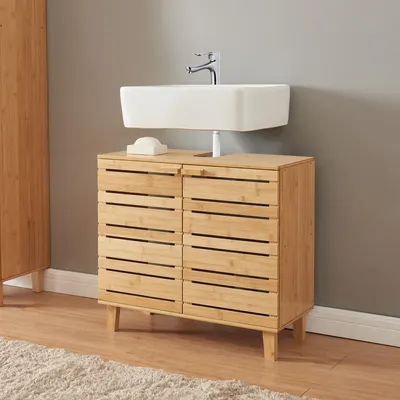 A bathroom vanity cabinet with a sink and faucet.