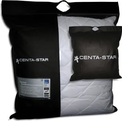 A pillow in its packaging, with a smaller pouch also visible.