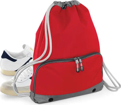 A red gym sack is shown next to a pair of white sneakers.