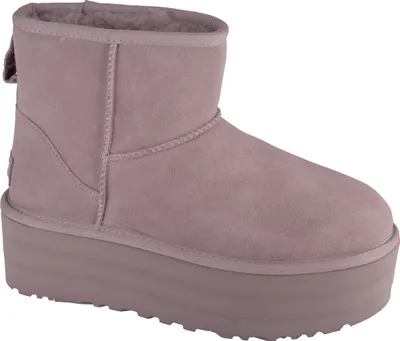 A single pink UGG boot with a platform sole is shown against a white background.