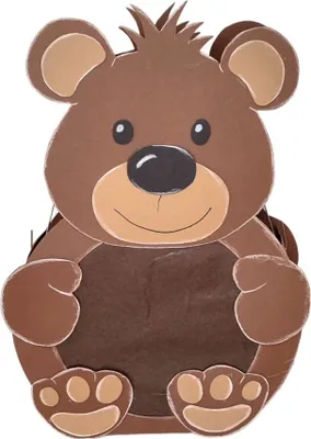 A cutout of a craft project in the shape of a bear.