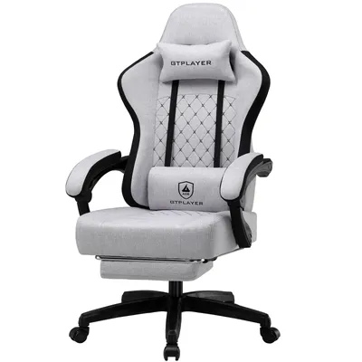 A light gray gaming chair with a footrest is shown against a white background.