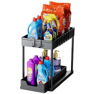 A two-tier storage organizer filled with cleaning supplies.