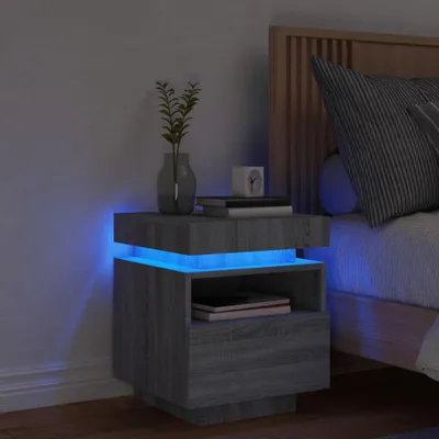 A modern bedside table with LED lighting in a bedroom setting.