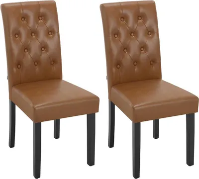 Two brown faux leather dining chairs with tufted backs and black wooden legs are shown against a white background.