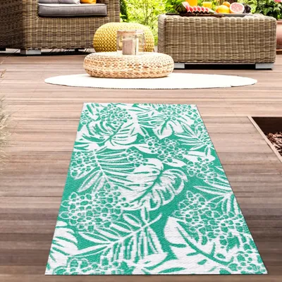 Produktbild von Wasserfester Outdoor-Teppich mit tropischem Design in petrol Größe - 90 x 150 cm