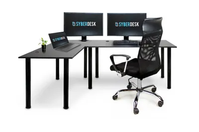 A black L-shaped desk with two monitors, a laptop, and a chair, set against a white background.