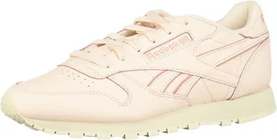A single pink Reebok sneaker is shown from the side against a white background.