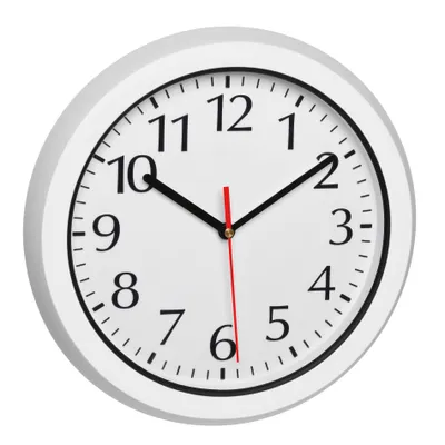A white analog clock with black numbers and hands, set against a white background.