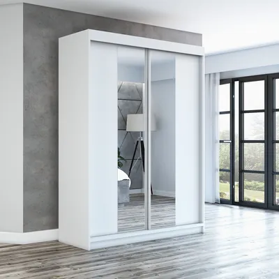 A white sliding door wardrobe with mirrored doors in a modern room setting.