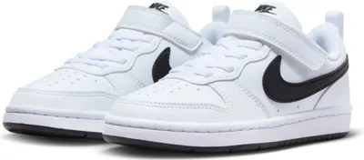 A pair of white Nike Court Borough Low Recraft K sneakers with black Nike swoosh logos.