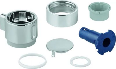 A collection of plumbing parts laid out on a white background.