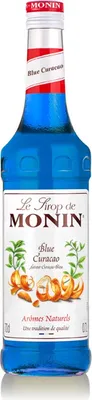 A bottle of Monin Blue Curacao syrup.