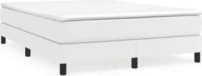 A white bed frame with a mattress on top, seen from a side-front angle.
