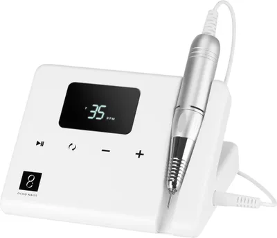 A white electric nail grinder with a silver handpiece resting in its stand.