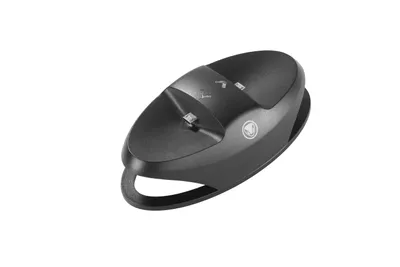 A black charging dock for a gaming console is shown against a white background.