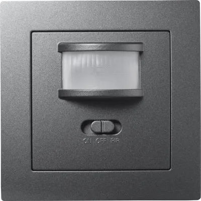 A close-up studio shot of a wall-mounted motion sensor.