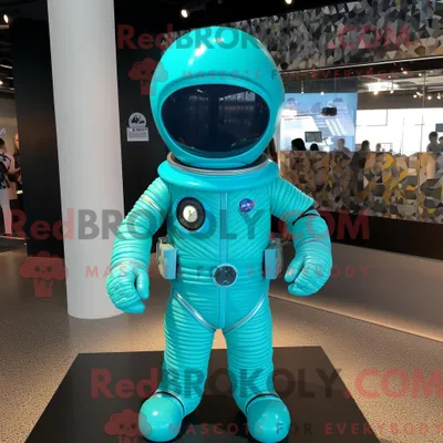Obrázok produktu pre Maskot spoločnosti REDBROKOLY je tyrkysová postava astronauta oblečená v mini sukni a overale