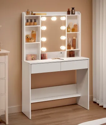 A white vanity table with a lighted mirror and shelves filled with makeup and decor.