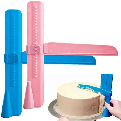 A cake decorating tool set and a cake being decorated.