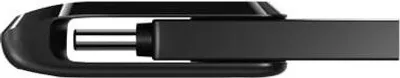 A close-up side view of a black USB flash drive.