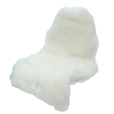 A white sheepskin rug is shown against a white background.