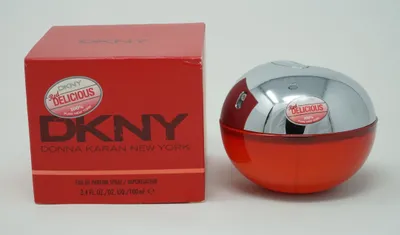 A red DKNY Red Delicious perfume bottle and its packaging are displayed on a white background.