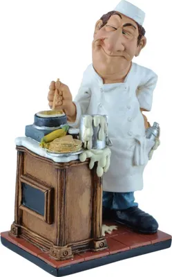 A figurine of a chef making crepes.