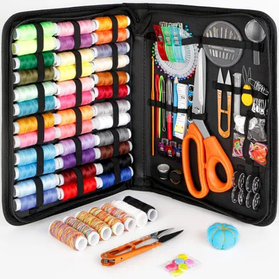 An open sewing kit case filled with various sewing supplies.