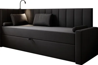 A black upholstered daybed with a headboard and integrated mattress, shown from a three-quarter angle.