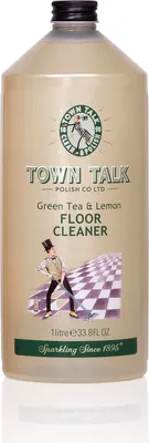 A bottle of Town Talk Green Tea & Lemon Floor Cleaner with a graphic of a person cleaning a checkered floor.