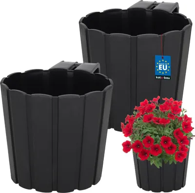 Two black hanging planters are shown, one in the foreground and one in the background. A pot of red flowers is in the foreground, to the right of the planters.