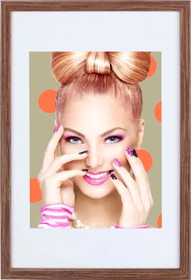 A woman with a bow-shaped hairstyle and vibrant makeup poses with her hands near her face, set against a backdrop of orange polka dots.