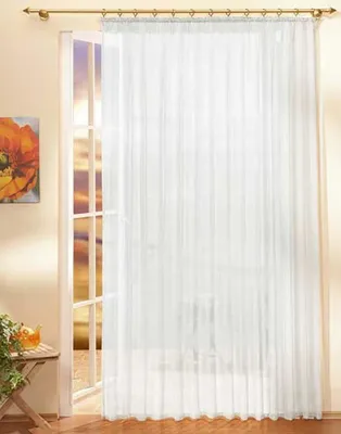 A sheer white curtain hangs in front of a doorway with a view of a sunset through the glass panes. A small table with a plant and a teapot is visible to the left.