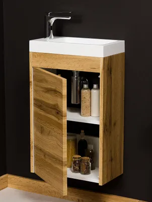 A wall-mounted bathroom vanity with a sink and faucet, showing the inside of the cabinet with various toiletries.
