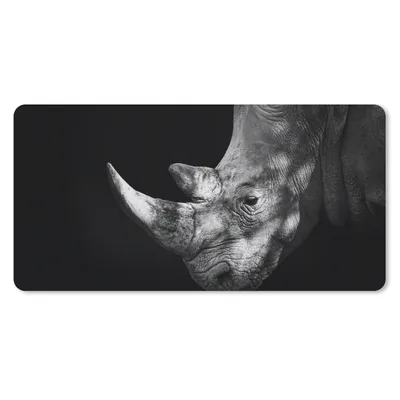 Produktbild von MuchoWow® Schreibtischunterlage Rhinozeros auf schwarzem Hintergrund 80x40 cm - XXL Mauspad - Gaming Mauspad