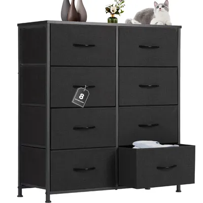 A black fabric dresser with eight drawers is shown against a white background. A small cat is sitting on top of the dresser.