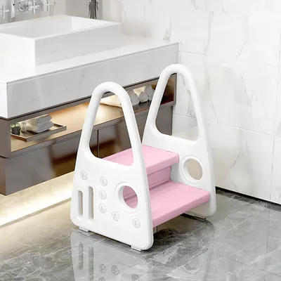 A pink and white step stool in a modern bathroom.