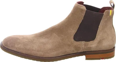 A side view of a beige suede Chelsea boot.
