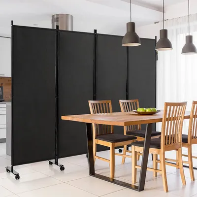 A room divider is set up in a dining area next to a kitchen.