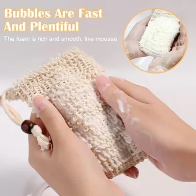 Produktbild von 4 beige Sisal-Seifensäckchen aus Naturmaterial, mit Kordelzug und Massagefunktion, für das Bad und die Reise