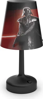 A black table lamp with a Darth Vader graphic on the lampshade.