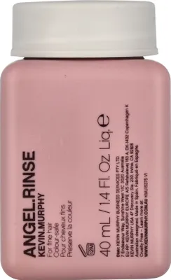 A close-up studio shot of a small pink bottle of Kevin Murphy Angel Rinse conditioner.