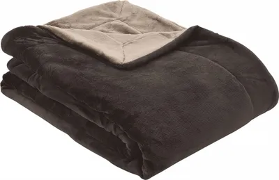 A folded blanket with two different colored sides.