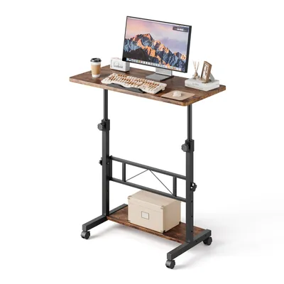 A mobile standing desk with a computer, keyboard, and cup on top, set against a white background.
