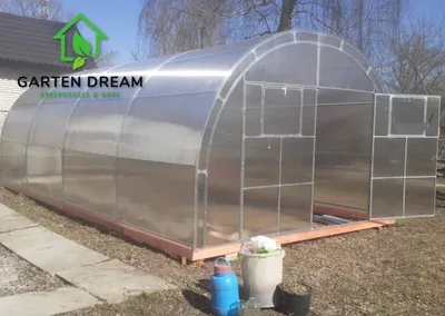 Obrázek produktu pro Polykarbonátový skleník Garden Dream "Oasis" 4x6m z oceli, s 6mm polykarbonátem S velkými dvojitými dveřmi na každé straně