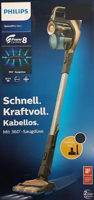 The image shows the packaging of a Philips SpeedPro Max cordless vacuum cleaner, with the product itself prominently displayed.